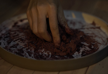 Mixing incense into paste.