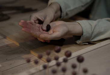 Portioning incense paste.