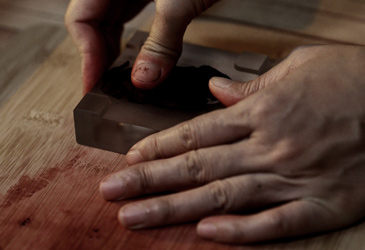 Pressing incense into shape.
