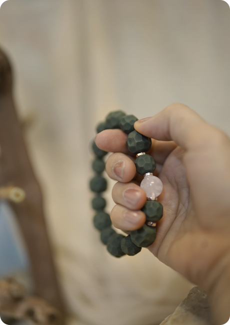 Bracelet held in hand.